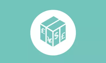 Caja con símbolos de divisas: libras, yen y dólar sobre fondo verde.